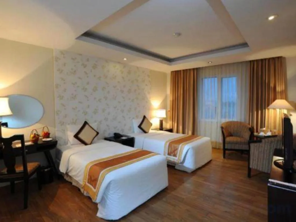 Bed in Cosiana Hotel