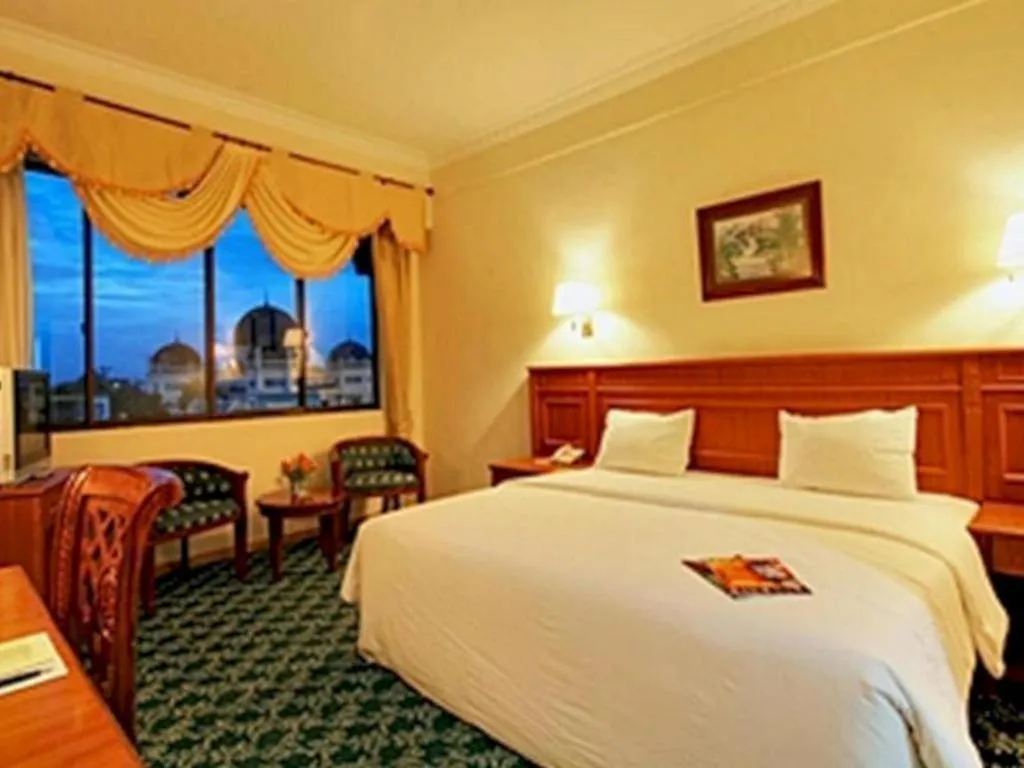 Bed in Madani Hotel Medan