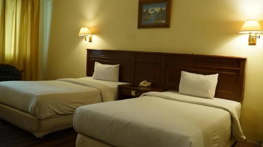 Bed in Madani Hotel Medan
