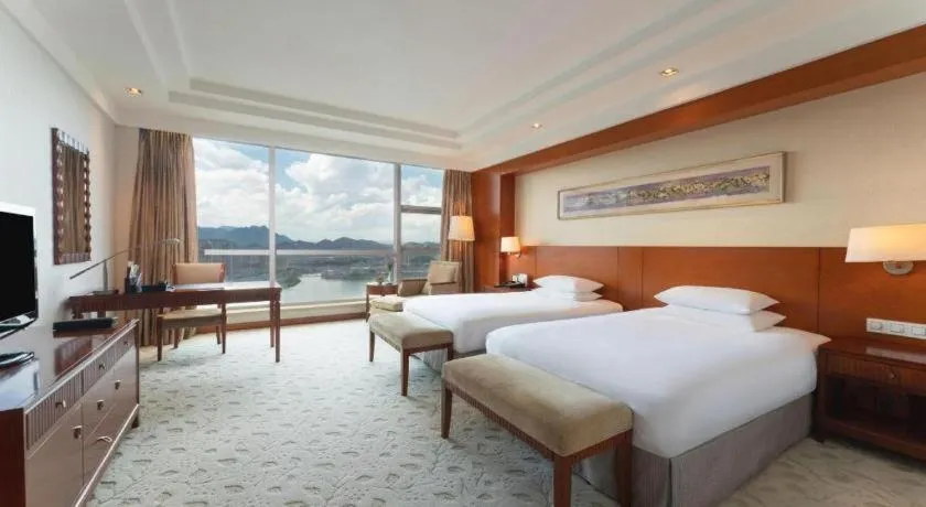 Bed in New Century Grand Hotel Ninghai Jinhai