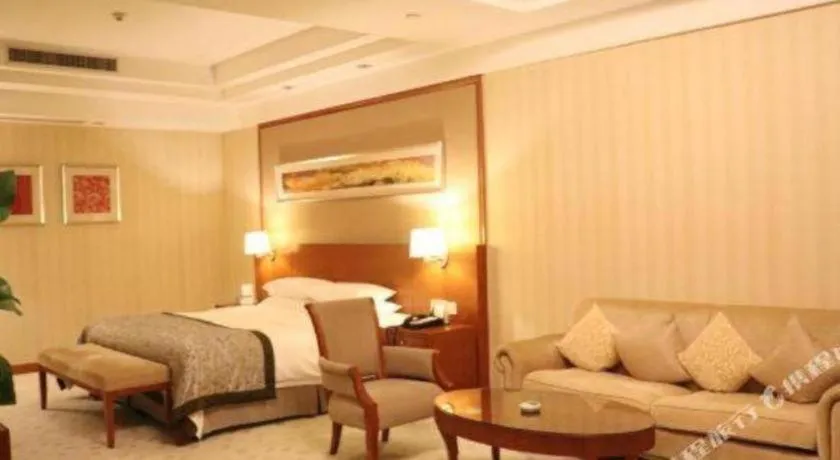 Bed in New Century Grand Hotel Ninghai Jinhai