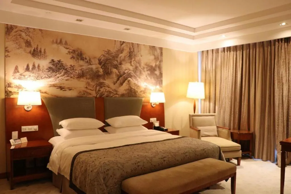 Bed in New Century Grand Hotel Ninghai Jinhai