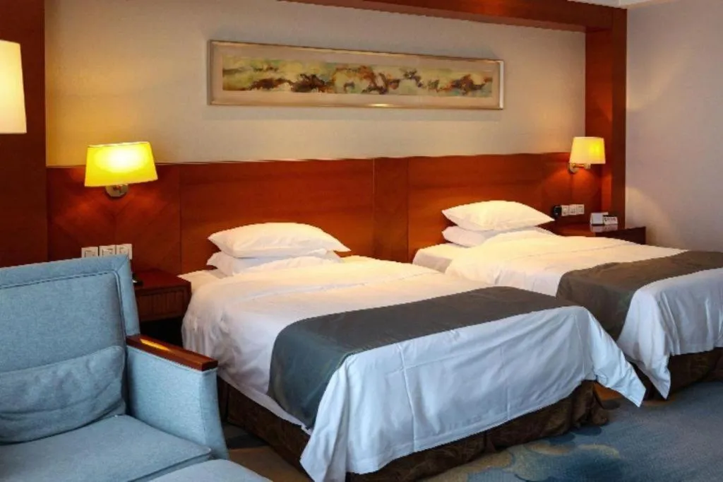 Bed in New Century Grand Hotel Ninghai Jinhai