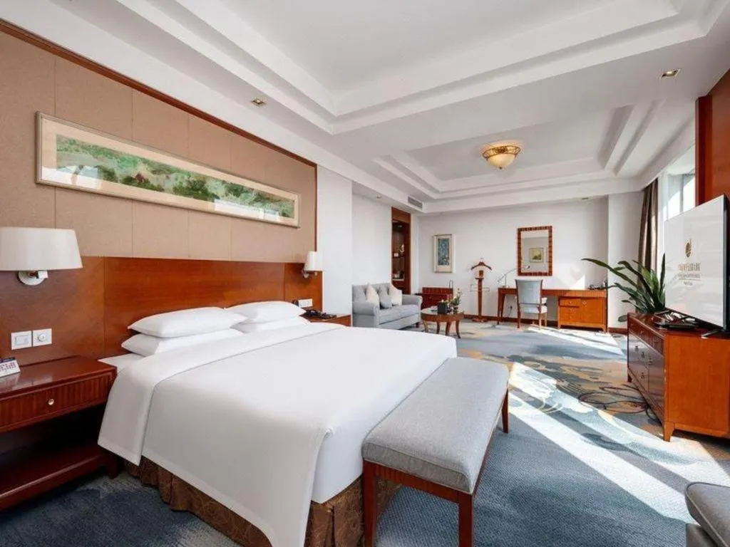 Bed in New Century Grand Hotel Ninghai Jinhai