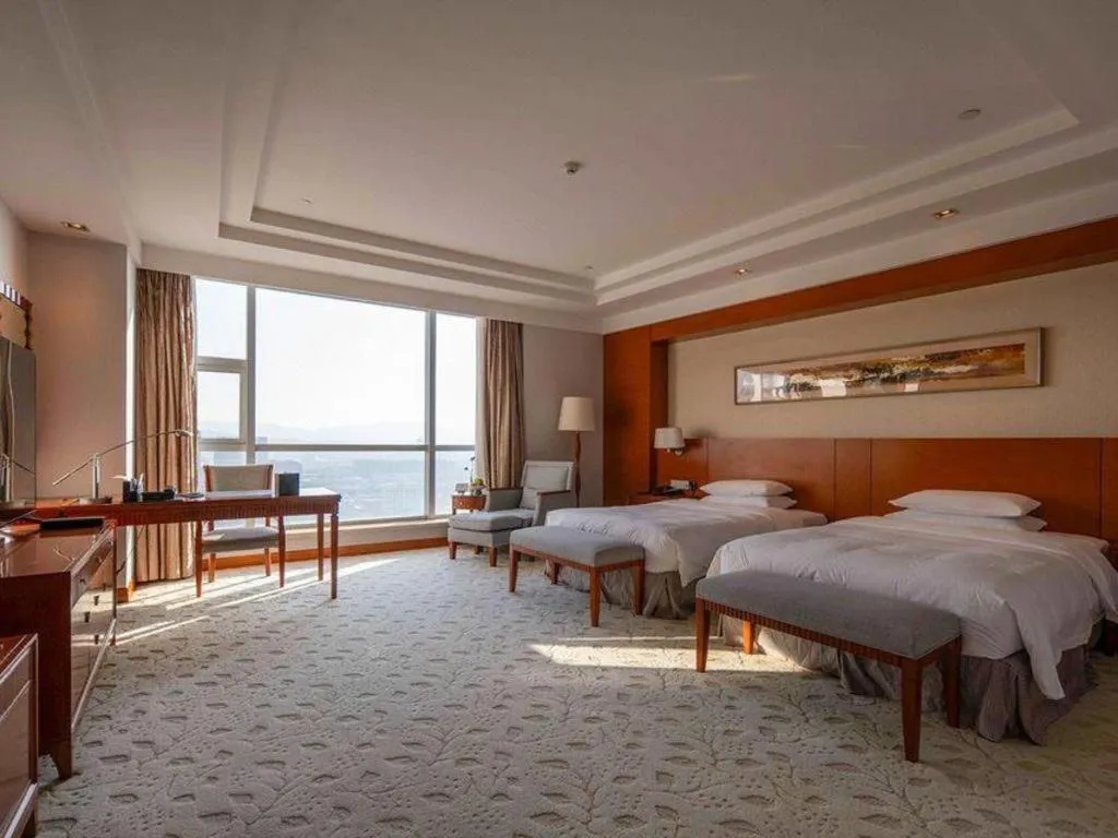 Bed in New Century Grand Hotel Ninghai Jinhai