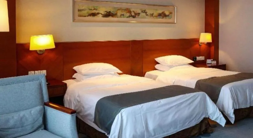 Bed in New Century Grand Hotel Ninghai Jinhai