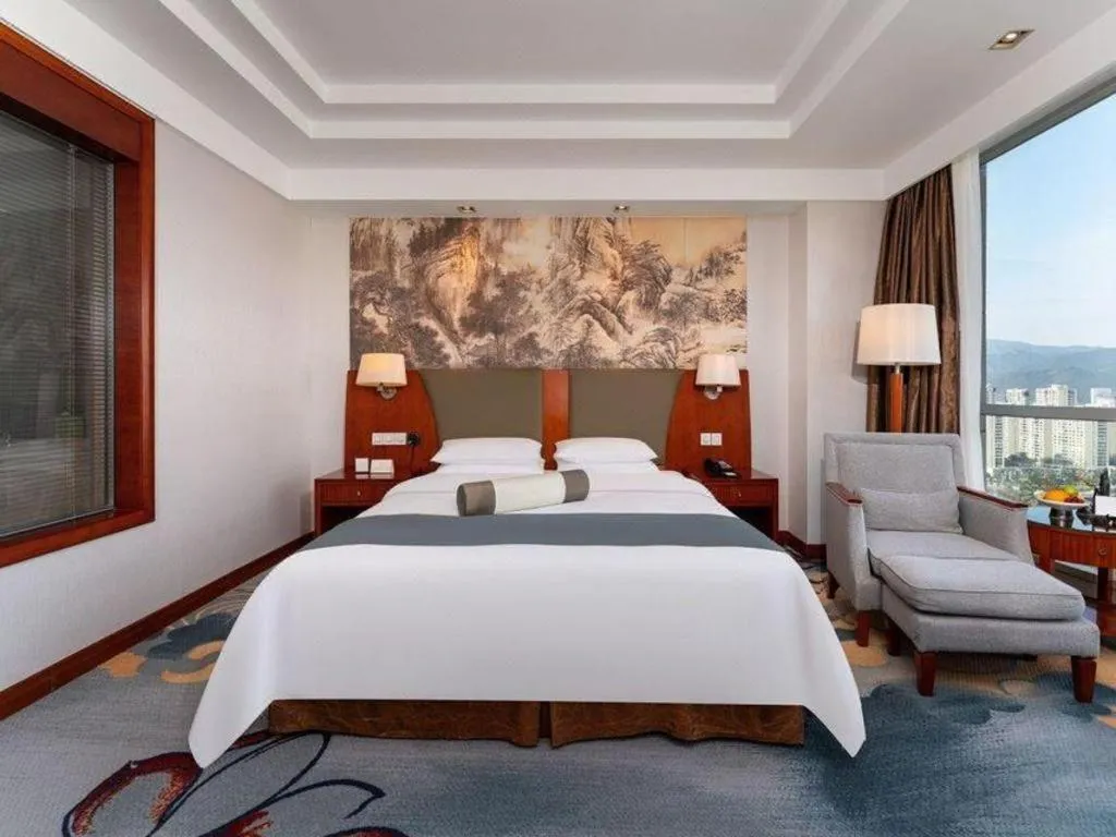 Bed in New Century Grand Hotel Ninghai Jinhai
