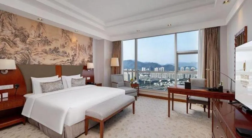 Bed in New Century Grand Hotel Ninghai Jinhai