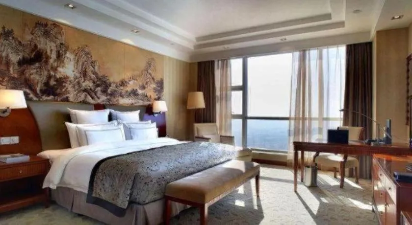Bed in New Century Grand Hotel Ninghai Jinhai