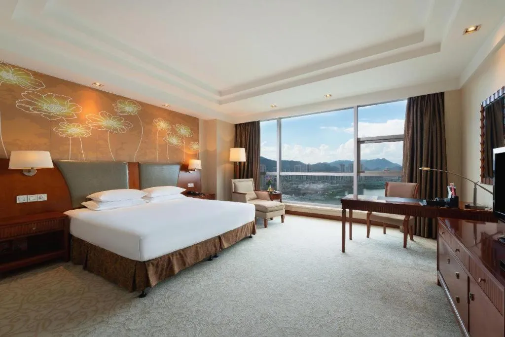 Bed in New Century Grand Hotel Ninghai Jinhai