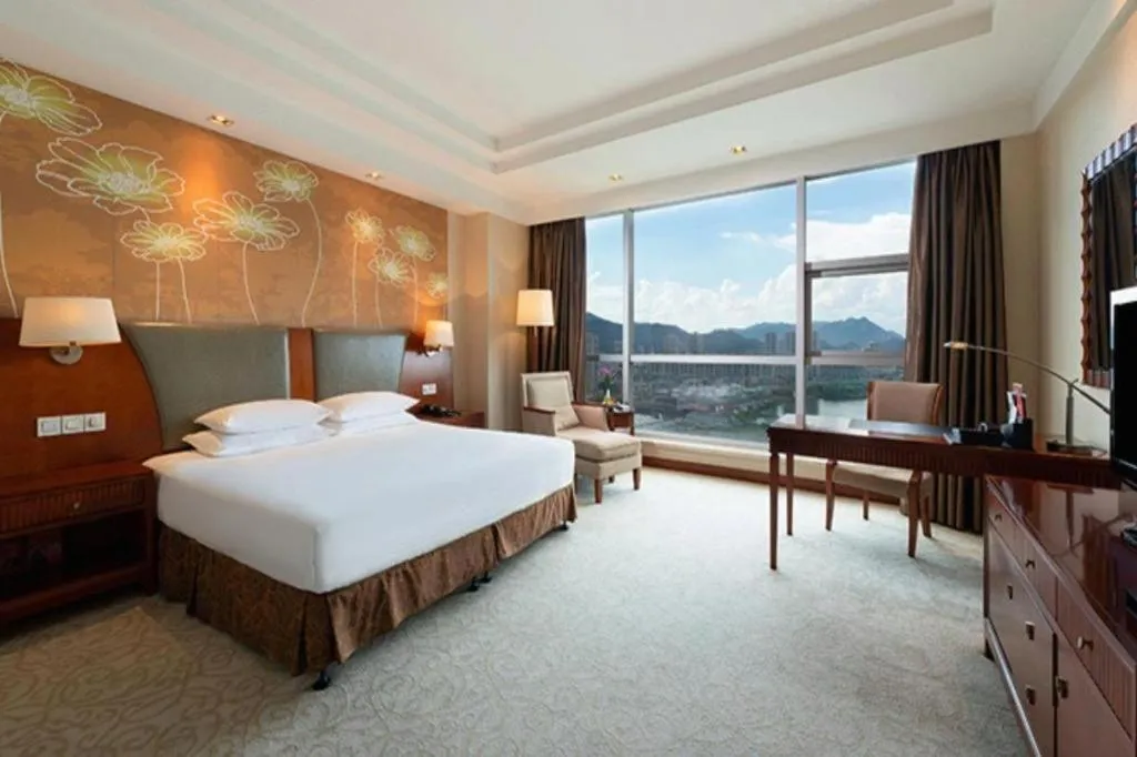 Bed in New Century Grand Hotel Ninghai Jinhai
