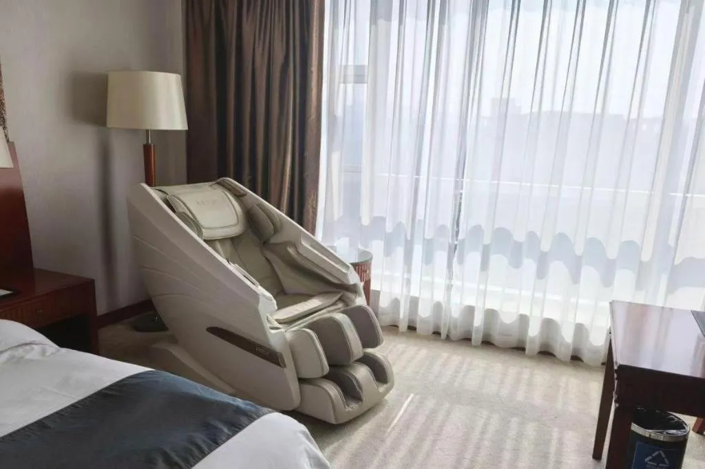 Bed in New Century Grand Hotel Ninghai Jinhai