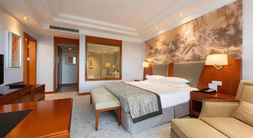 Bed in New Century Grand Hotel Ninghai Jinhai