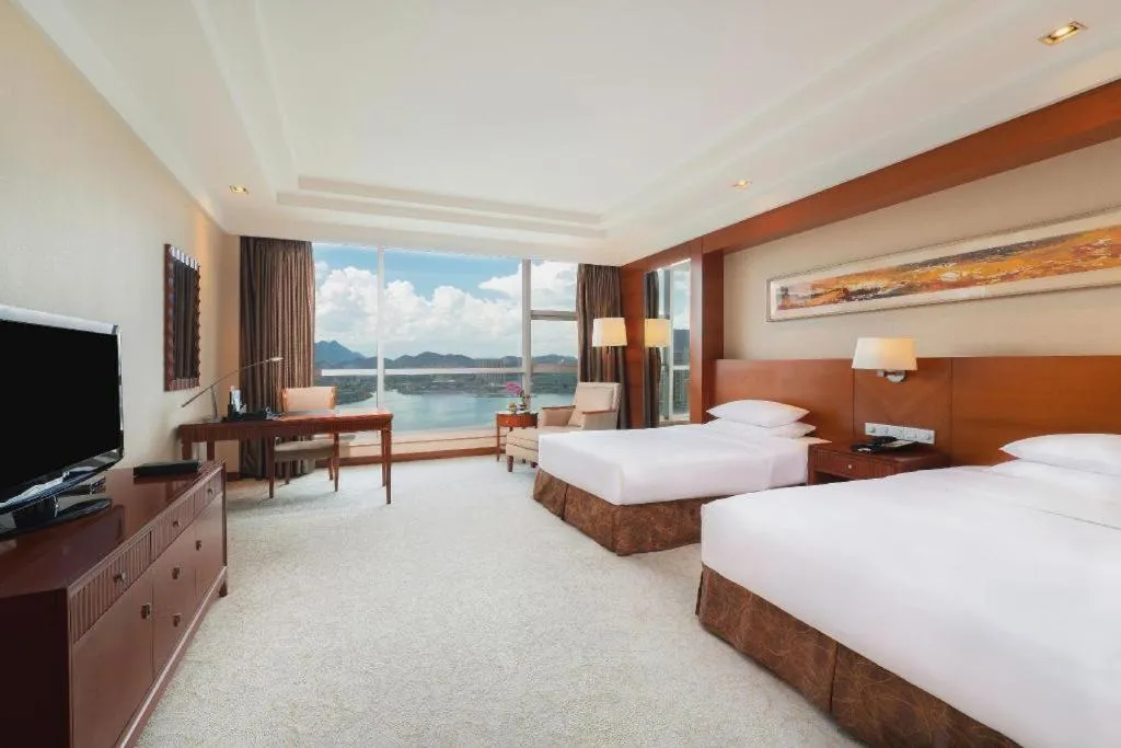 Bed in New Century Grand Hotel Ninghai Jinhai