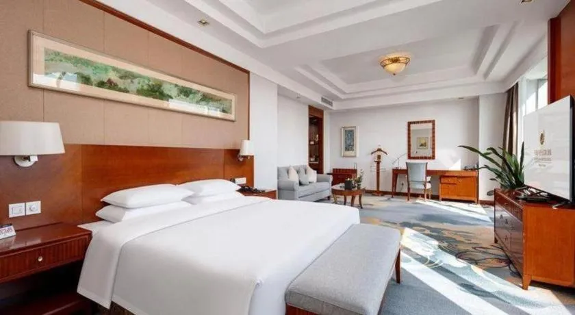 Bed in New Century Grand Hotel Ninghai Jinhai