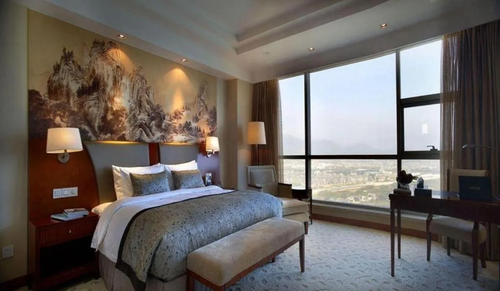 Bed in New Century Grand Hotel Ninghai Jinhai