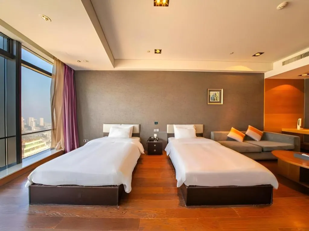 Bed in Grand Madison Qingdao Harbour-view Central（Former Qingdao Farglory Hotel）