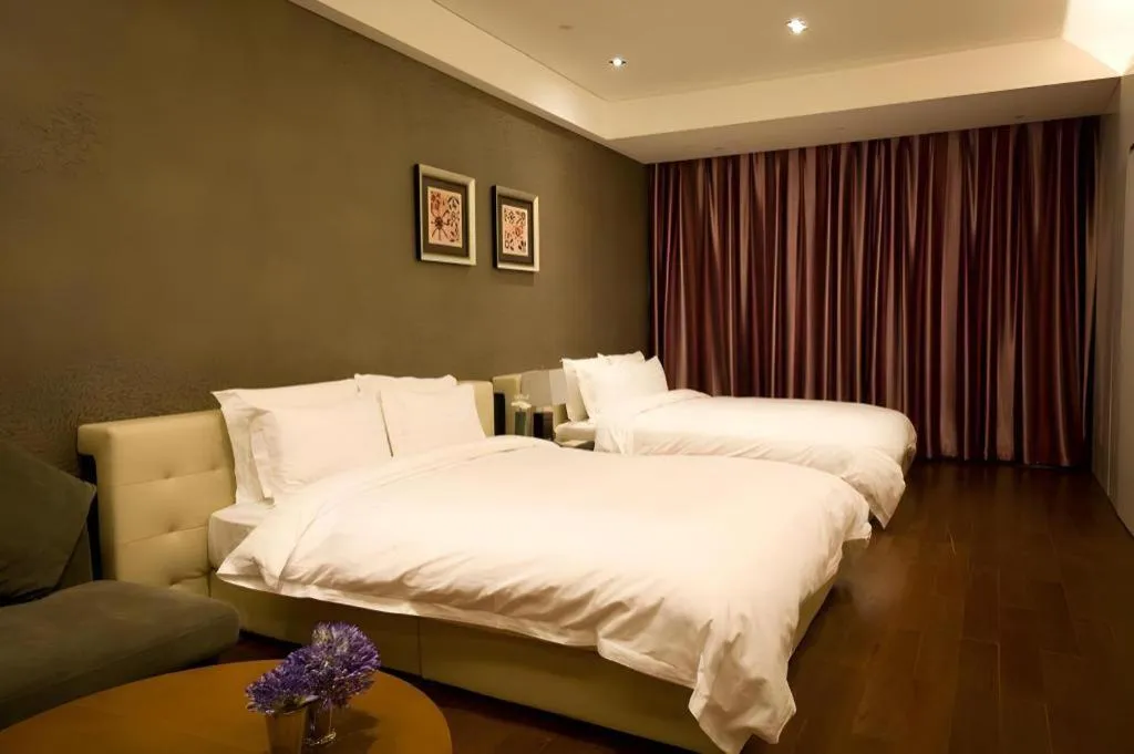 Bed in Grand Madison Qingdao Harbour-view Central（Former Qingdao Farglory Hotel）