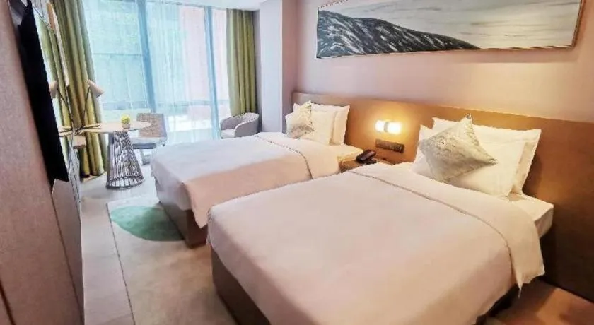 Bed in Kecheng Holiday Hotel