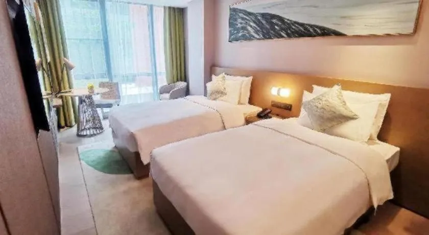 Bed in Kecheng Holiday Hotel