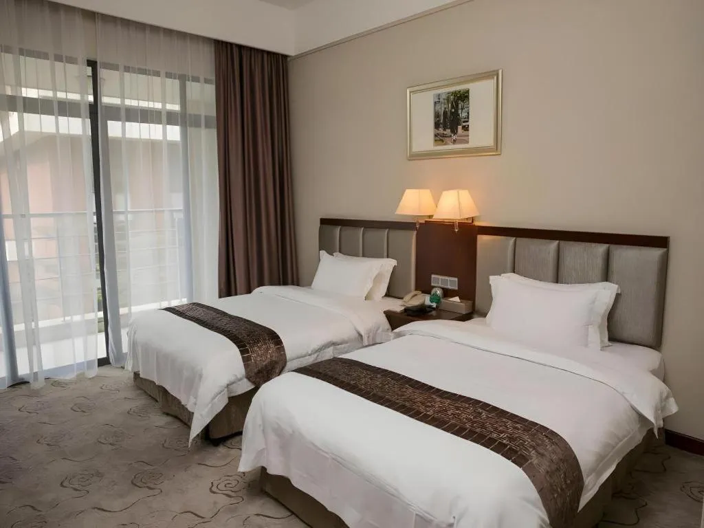 Bed in Kecheng Holiday Hotel