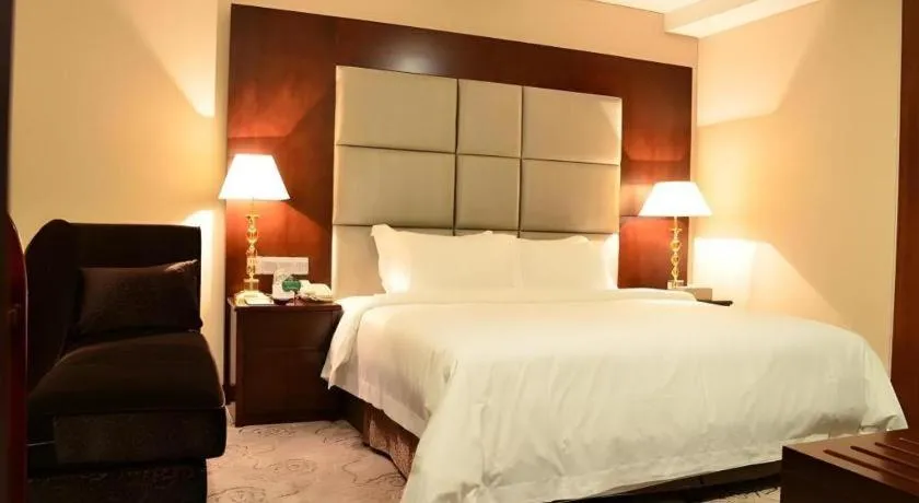 Bed in Kecheng Holiday Hotel