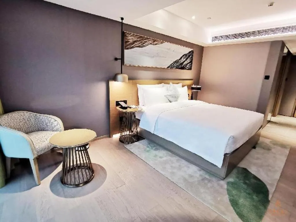 Bed in Kecheng Holiday Hotel