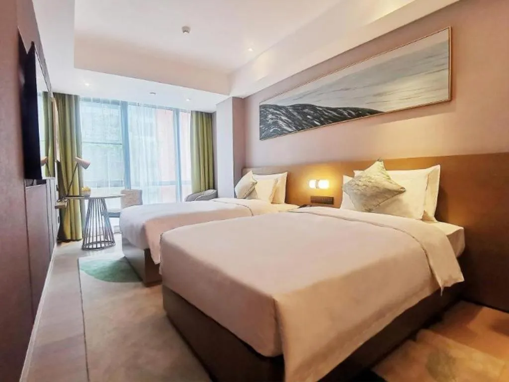 Bed in Kecheng Holiday Hotel