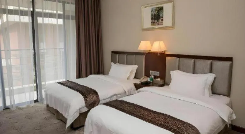 Bed in Kecheng Holiday Hotel