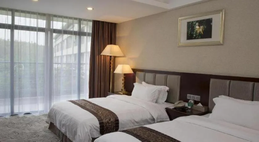 Bed in Kecheng Holiday Hotel