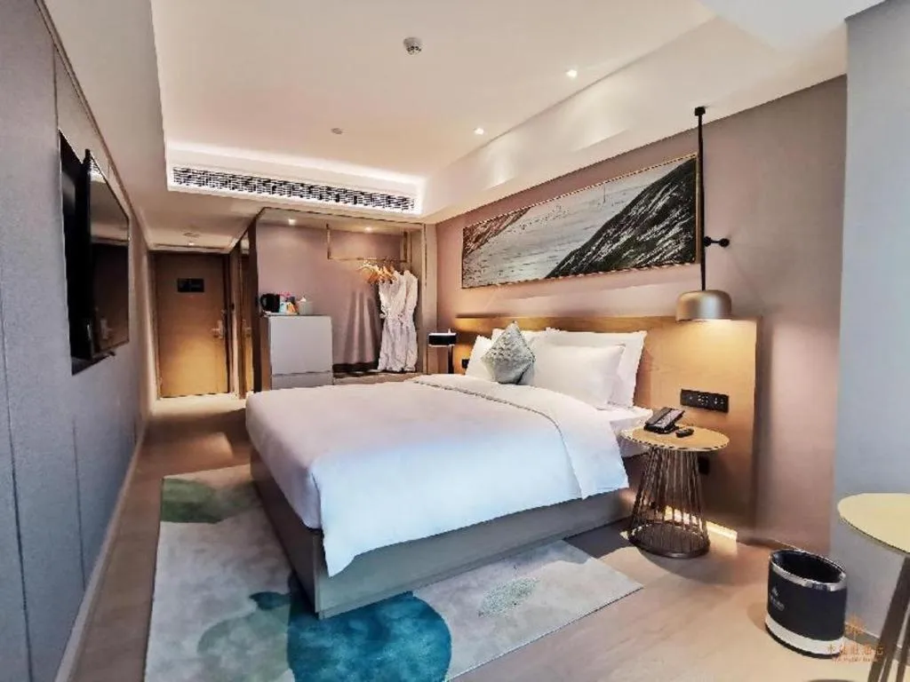 Bed in Kecheng Holiday Hotel