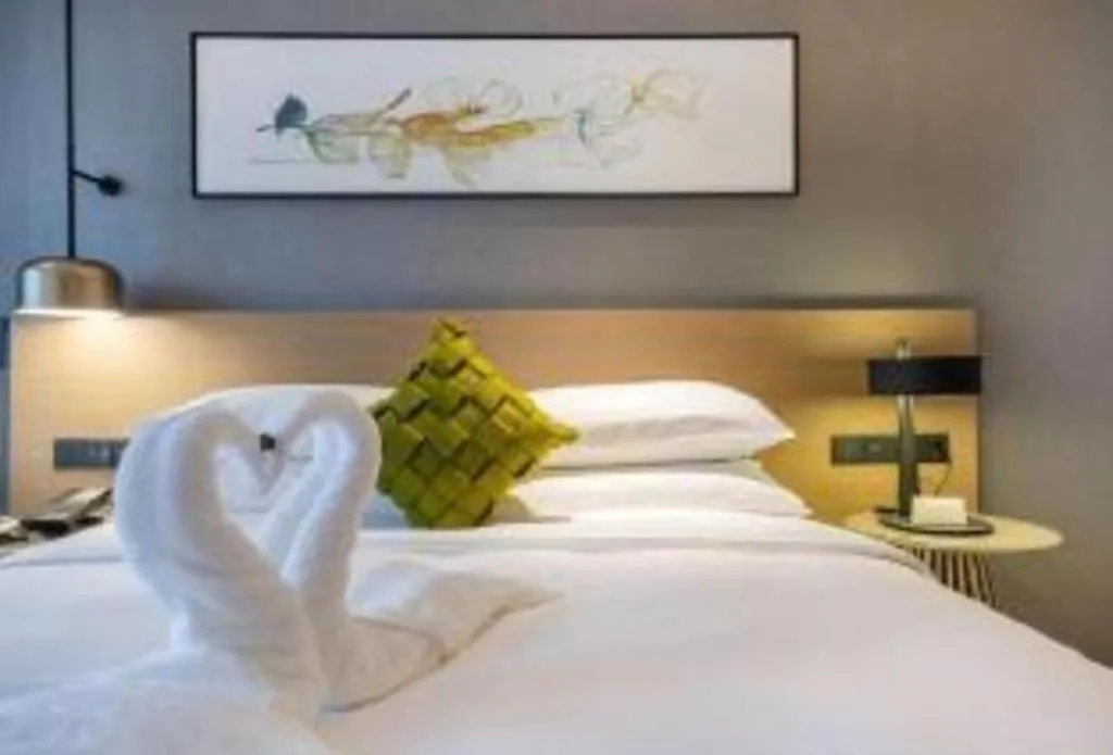 Bed in Kecheng Holiday Hotel