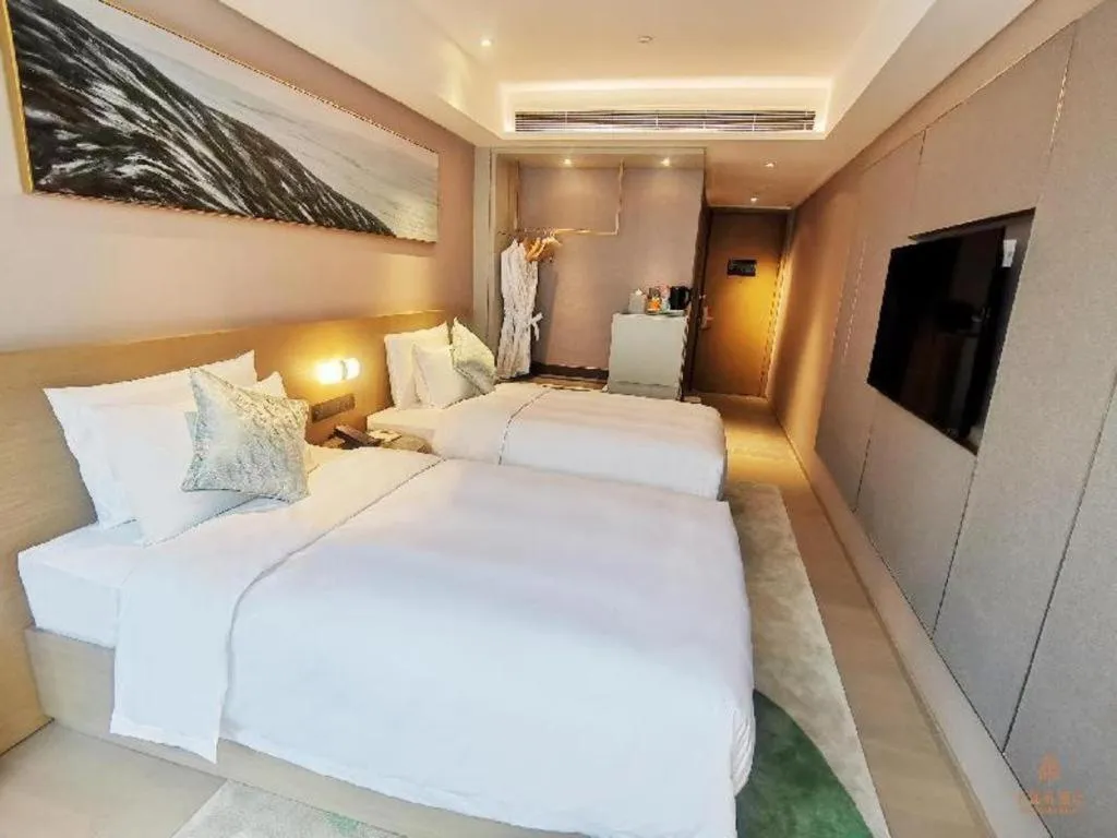 Bed in Kecheng Holiday Hotel