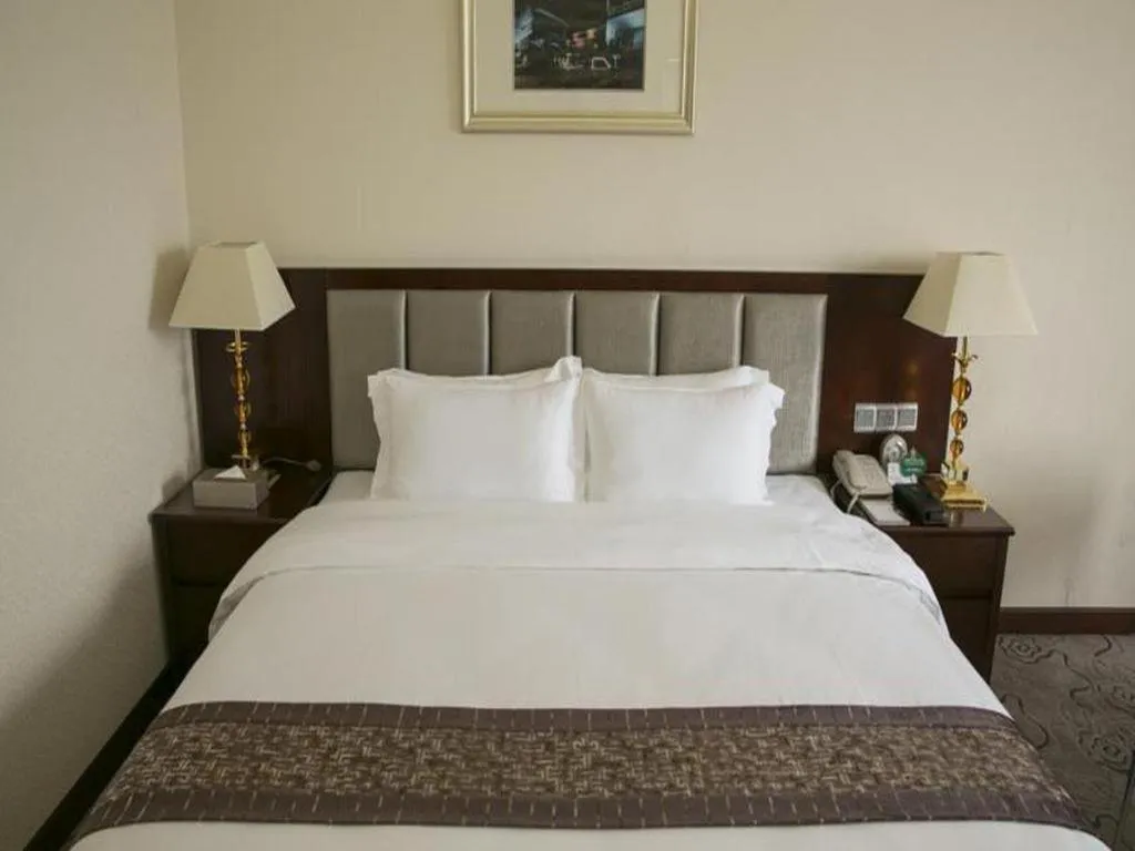 Bed in Kecheng Holiday Hotel