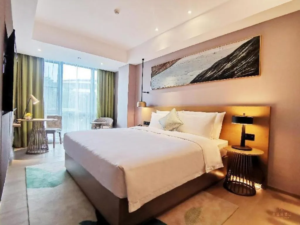 Bed in Kecheng Holiday Hotel