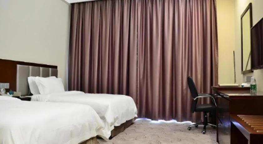 Bed in Kecheng Holiday Hotel