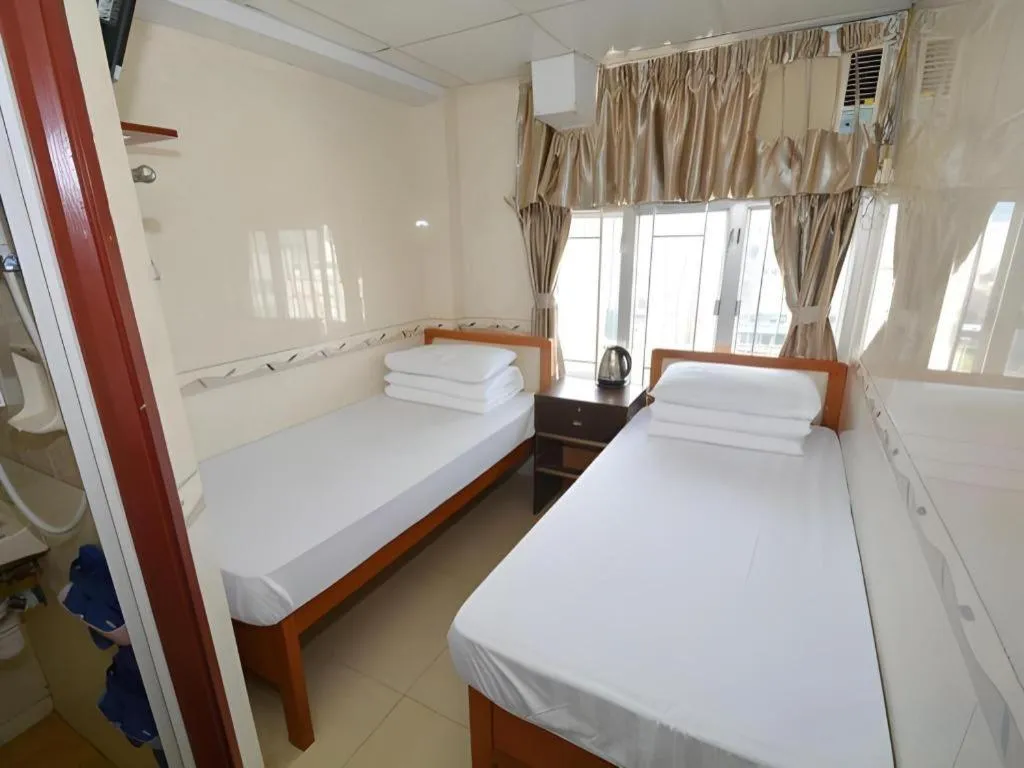 Bed in New Mong Kok Guest House