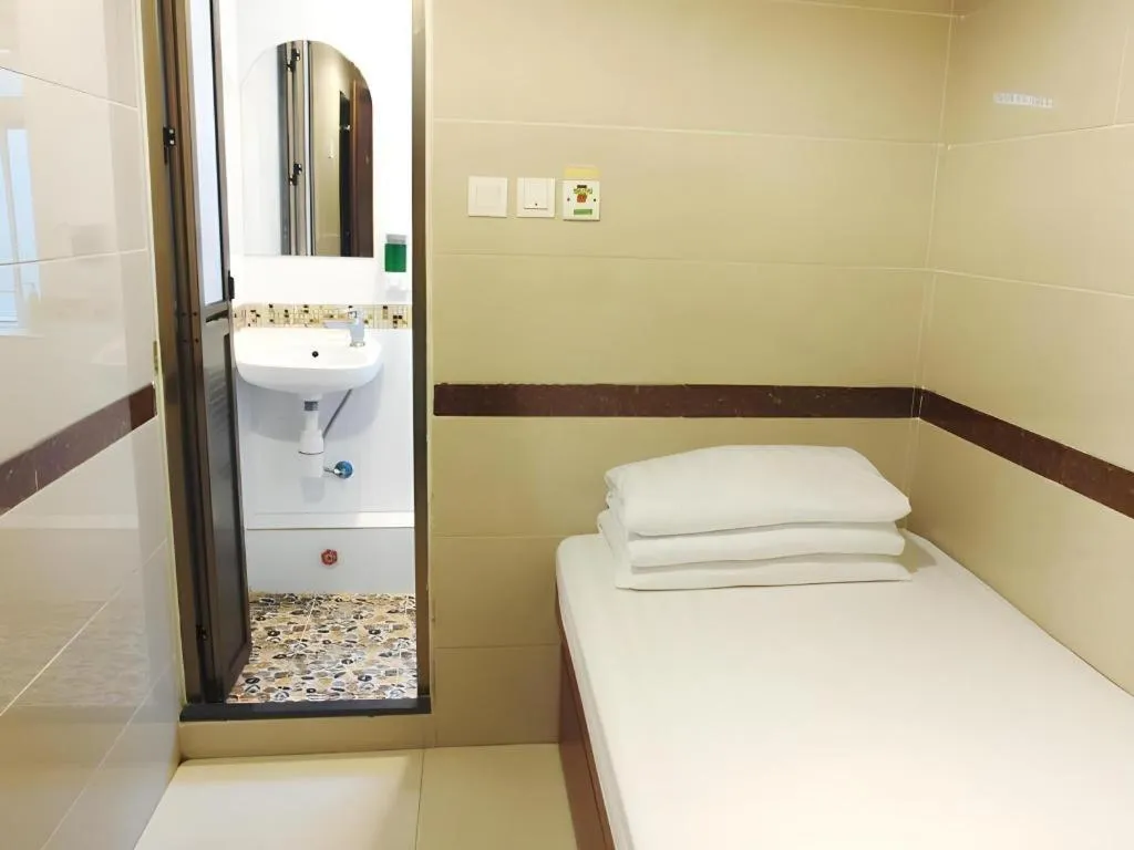 Bed in New Mong Kok Guest House