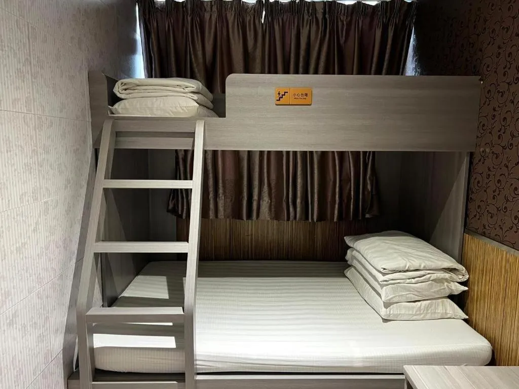 Bed in New Mong Kok Guest House