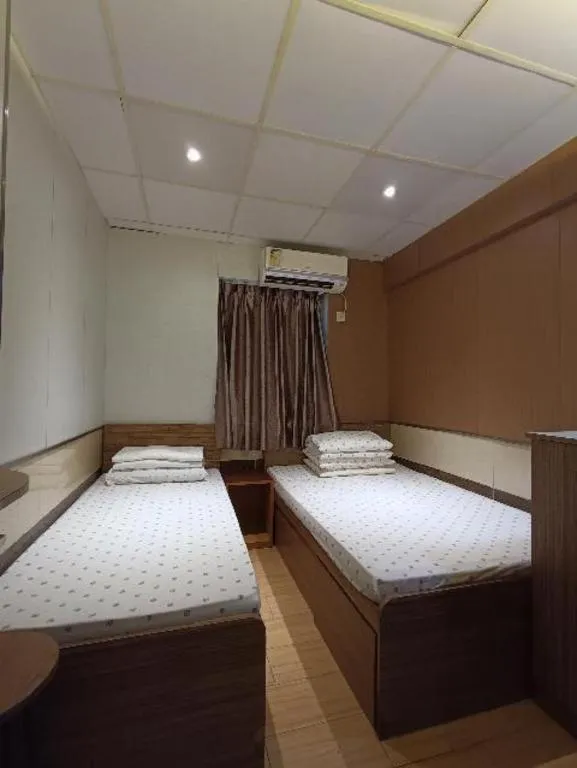 Bed in New Mong Kok Guest House