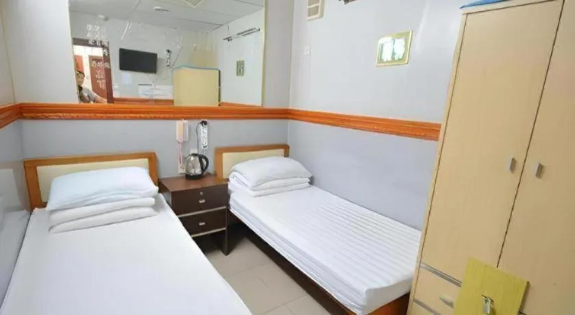 Bed in New Mong Kok Guest House