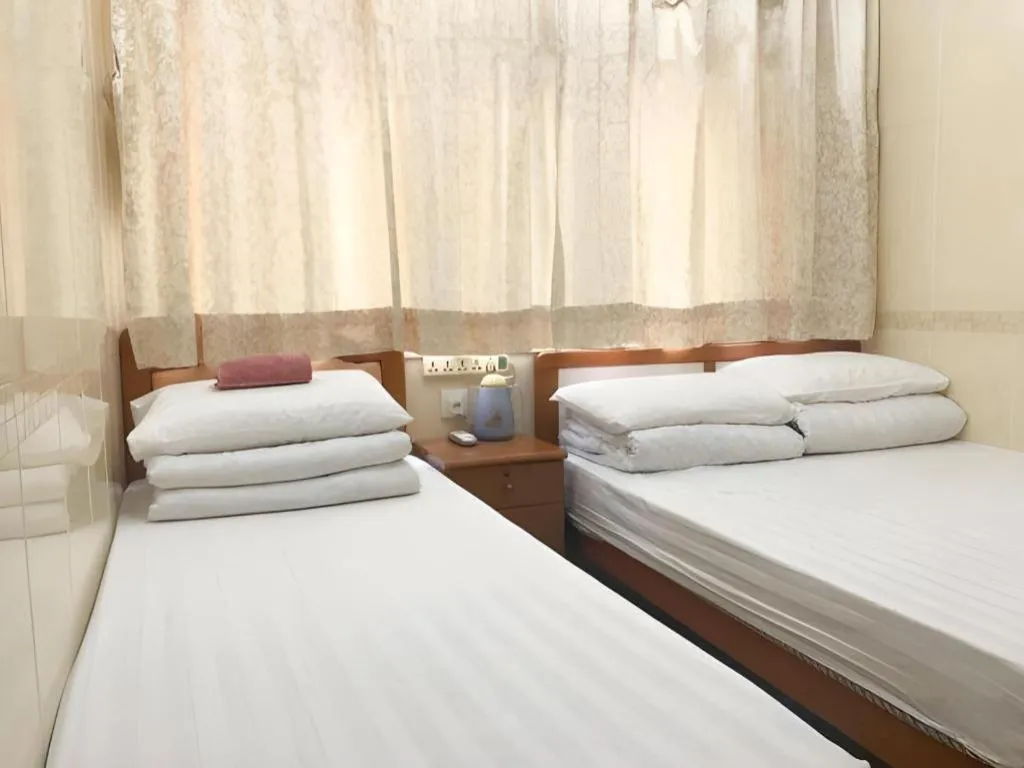 Bed in New Mong Kok Guest House