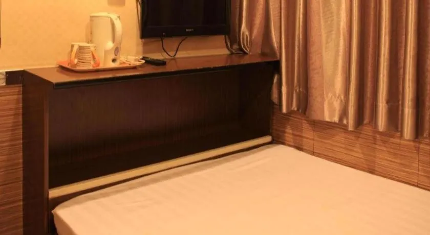 Bed in New Mong Kok Guest House