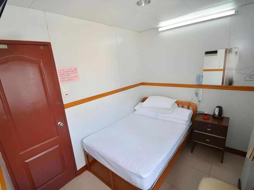 Bed in New Mong Kok Guest House