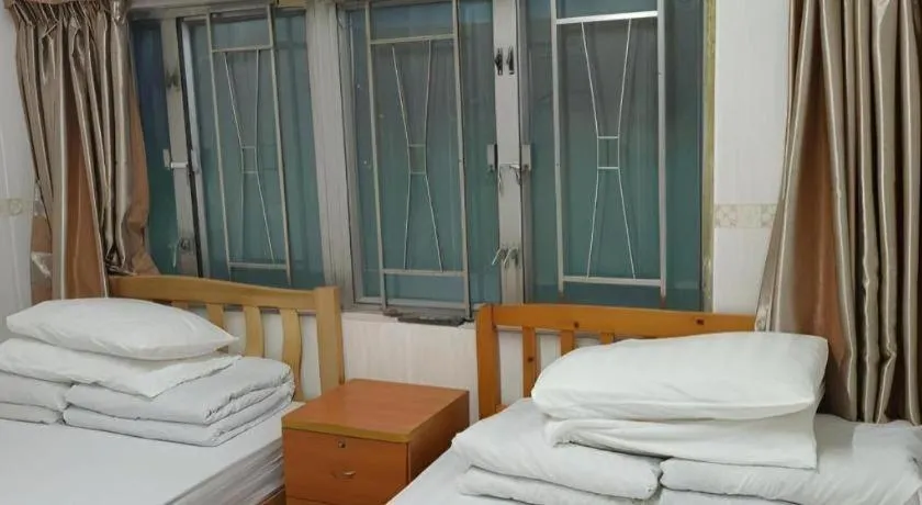 Bed in New Mong Kok Guest House