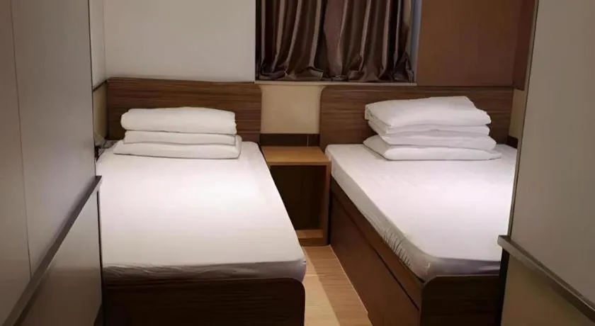 Bed in New Mong Kok Guest House