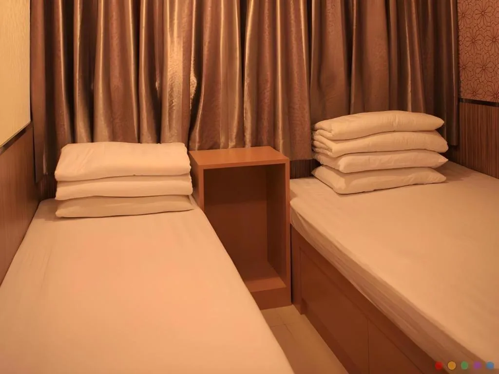 Bed in New Mong Kok Guest House