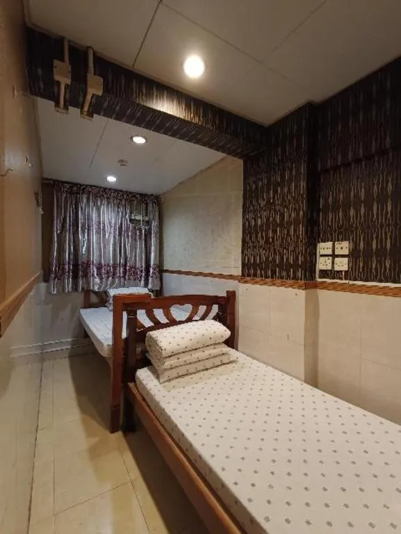 Bed in New Mong Kok Guest House