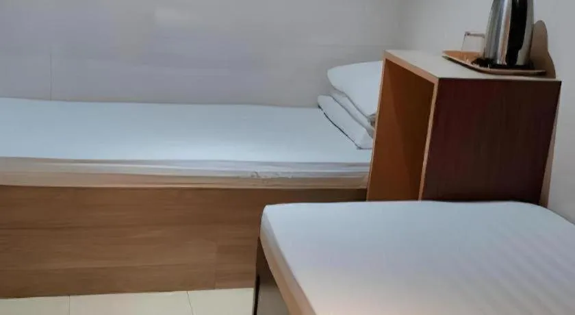 Bed in New Mong Kok Guest House