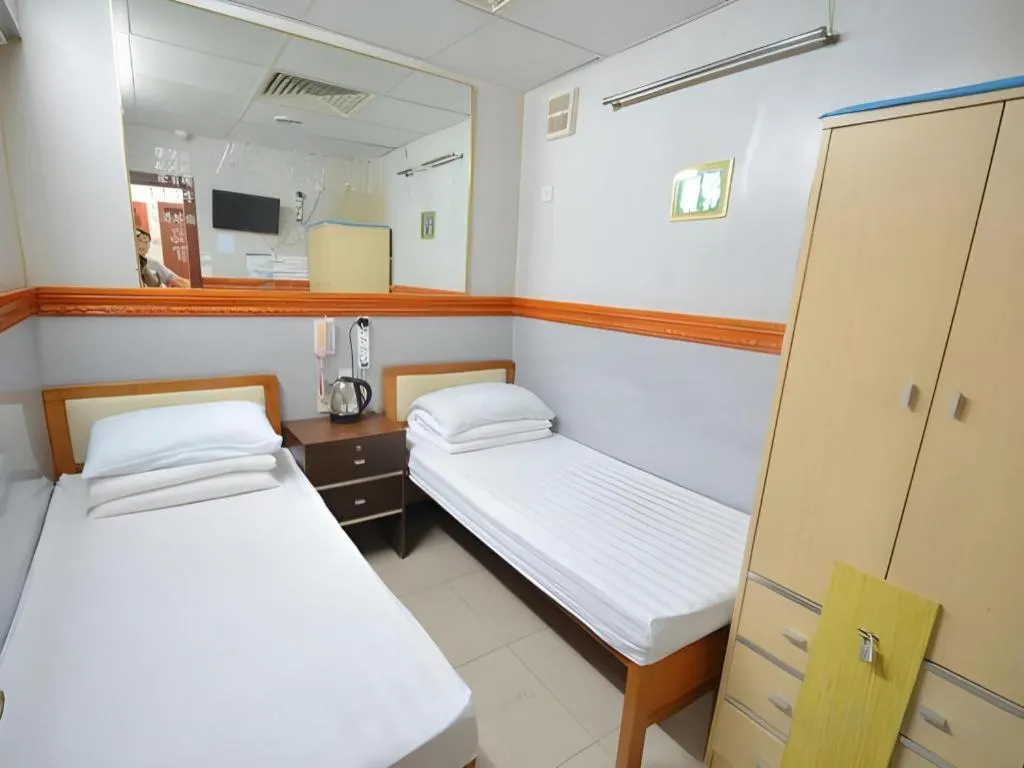 Bed in New Mong Kok Guest House